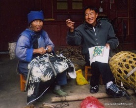 The artisan Bi Zhihui, right, and his grandmother work on embroidery from their home in Baisha, Lijiang. Bi's unique embroidery art, passed down through six generations, is a tradition that deserves more attention from tourists and tour operators in the area.