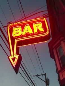 Bar street with a neon light-up "bar" sign