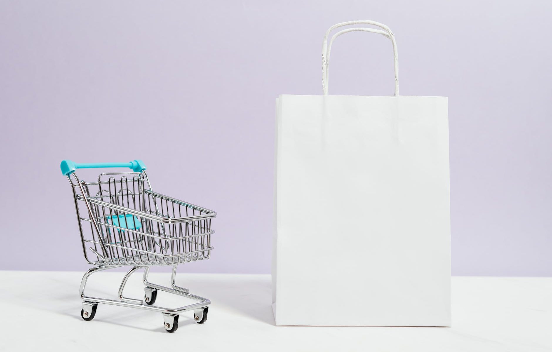 push cart and a white paperbag